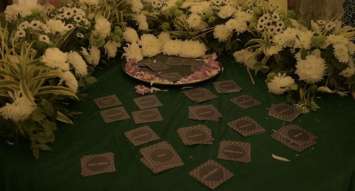 Wedding ceremony seating framed by floral arches